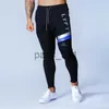 Pantalons hommes Hommes Joggers pantalons de survêtement Hip Hop mode mâle pantalons serrés hommes gymnases Fitness homme pantalon coton mince pantalon musculation hommes x1017