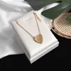 Marque de luxe coeur pendentif colliers boucles d'oreilles G lettre Simple amour collier femmes Designer ensembles en gros