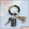 Porte-clés Longes Porte-clés Accessoires de mode Noir Givré Bracelet de perles en bois Porte-clés Motif Pompon Pendentif Bracelets Femmes Dhvjs