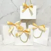 Geschenkpapier 10 Stück Schmuck Papiertüte Kosmetik Geschenktüte mit Band Hochzeit Verpackung Box für Geburtstagsparty Tasche/Pyjama Perücke Buch Großhandel 231017