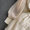 秋と冬の韓国版セレブの気質バブル長袖丸いネックニットパネルウエスト縮小Aラインメッシュドレス
