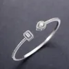 Bangle Huitan Trendy Luxury Women S manschettarmband med lysande kubikzirkoniumgrön kristallblå silverfärg Guldfärgsmycken 231016