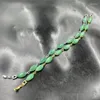 Pulseira de olho de cavalo de jade verde com fundo branco revestido a vácuo de fio