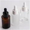 Opslagflessen Potten Opslagflessen Potten 100 stuks 30 ml platte Shoder Frosted helder glazen druppelflesje met witte deksel 1 Oz Amber Serum Dhlr7