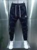 Mężczyźni S Stitching Harajuku Hip Hop Street Pants Harem Wysoka jakość luksusowej marki Brands 231016