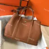 tuinfeest designer tas herentas emmer tas man portemonnee Tote emmer tassen 7A+ handgemaakte luxe designer handtassen klassiek mode Togo leer canvas tuintas