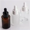 Opslagflessen Potten Opslagflessen Potten 100 stuks 30 ml platte Shoder Frosted helder glazen druppelflesje met witte deksel 1 Oz Amber Serum Dhlr7