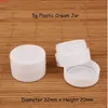 100pcs / lot en gros en plastique 5g blanc mini pot de crème femmes contenant cosmétique 1 / 6oz bouteille à fond concave rechargeablehaute quantité