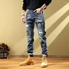 Jeans da uomo coreano bella toppa strappata vintage autunno 2023 versatili pantaloni elastici europei e americani per giovani
