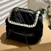 Diseñadores de moda Chan Mochila x letra Mujer Mochila de lana de cordero Mochilas para mujer Moda de otoño e invierno Mochila Diamond Lattice de todo fósforo