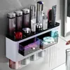 Toothbrush Holders BAISPO Toothbrush Holder With Magnetic Cups Automatic Toothpaste Dispenser Holder Wall Mount Storage Bathroom Accessories 231013