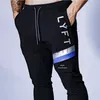 Pantalons hommes Hommes Joggers pantalons de survêtement Hip Hop mode mâle pantalons serrés hommes gymnases Fitness homme pantalon coton mince pantalon musculation hommes x1017