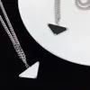 2021 Luksusowy designerski łańcuch naszyjnika dla kobiet mężczyzn urok biżuterii moda tytan stalowa czarny biały wisiorek Włochy Wysoka jakość Męs301i