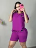 Survêtements pour femmes 2023 Été Couleur unie Broderie Élastique Casual Col rond T-shirt à manches courtes Taille haute Wrap serré Shorts de hanche