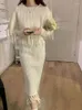 ワークドレス秋の冬のソリッドニットストライプタッセル2ピースセット女性エレガントなOネックプルオーバーケープトップエラスティックハイウエストミディスカートスーツ