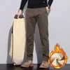 Męskie spodnie jesienne zima gruba ciepłe spodni spodni Business Casual Polarne Spodnie plus rozmiar 40 szczotkowane moda luźna joggery mężczyzna