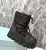 Designer schoenen Nylon gabardine sneeuwfeestlaarzen geëmailleerde metalen driehoek Tech dynamische charme Enkellaarsjes met reliëfzoolpatroon