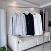 Abrigos de diseñador para mujer Sudadera con cremallera Sudaderas con capucha blancas y negras sueltas Chaquetas femeninas Ropa deportiva Sudaderas para correr