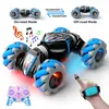 Diecast Model Latest 4WD remote control stunt car 2 4G wireless RC drift LED lights watch gesture sensor rotating children s toy gift 231017