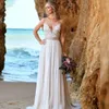 Sexig rygglös chiffong bohemisk bröllopsklänning spets applikation ärmlös strand v-hals brudklänning klänning de mariee