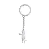 Hot selling cute cartoon small animal pendant with vertical thumb and puppy pendant personalized and minimalist stainless steel keychain