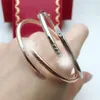 Nagelarmband kvinnor älskare manschett rostfritt stål lyxdesigner par öppna naglar armband charm mode smycken gåvor för woman187t
