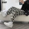 Męskie spodnie w stylu koreański luźne sznurka w kratę plus size kpop ubrania 2021 Ulzzang moda joggers męskie odzież swobodny pot313t