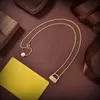 Marque de mode LOGO boucle d'oreille collier série doré mini sac pendentif bijoux de créateur pour la Saint-Valentin avec boîte d'origine