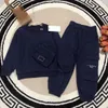 luxury Tracksuits baby autumn Sets high quality kids suit Size 100-150 CM 2pcs bag pocket design Round neck sweater and sports pants Aug30