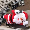 6m親切に笑顔のインフレータブルサンタクロースクリスマスフィギュアモデルエア爆破屋外ショー用のギフトバッグを運ぶサンティ