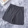 Shorts pour hommes marque de mode décontracté couleur unie séchage rapide Vintage Cargo pantalon mâle lâche taille élastique longueur au genou