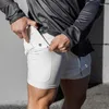 Jackets de corrida ao ar livre correndo de longa distância, execução de fitness camada dupla de cor sólida shorts esportes calças de secagem rápida masculina