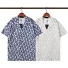 デザイナーメンズTシャツレット付きデザインのセンスストリートラペルスプライスポロプリント半袖夏シャツの男性ルースプリントシャツ