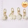 Fashion Rose Bowknot Pearl Keychain Camellia Flower Exquitiat Tassel Keyring Accessories for Women Earphone Case Decoration Gift