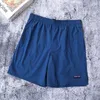 Shorts pour hommes marque de mode décontracté couleur unie séchage rapide Vintage Cargo pantalon mâle lâche taille élastique longueur au genou