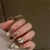 Faux ongles purs faits à la main personnalisés portant une armure luxueuse et un oeil de chat pour des milliers de dames précieuses