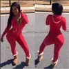 Diseñador de montura larga Mujeres Mujeres de invierno Rompers con capucha sólido Solidy Bodycon Jumpsuits informales de una pieza.