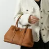 Sac de créateur de luxe sac à bandoulière asymétrique Simple et à la mode pour femmes avec un sac à main en peau de vache de couche supérieure