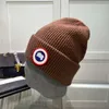 Regalo Designer Sciarpa di moda Cappello d'oca Berretto invernale Calda protezione per le orecchie lavorata a maglia Temperamento casual Berretto freddo Sci C