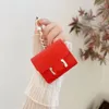 Designer oortelefoons Key Buckle Womne Wallet Tassen hanger Pas tas auto schattige sleutelhanger handgemaakte zachte lipstick mini -sleutelhangers