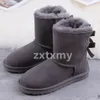 Tasman Pantoufles Australie Bottes de neige classiques ultra mini pour femme - Bottines courtes mi-genou en fourrure australienne - Bottes de neige d'hiver à plateforme rose châtaigne avec nœud papillon