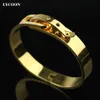 Mode kvinnor manschettform speciella låsarmband armband 316l rostfritt stål naglar armband gult guld med cz250b