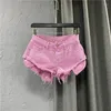 Pantaloncini da donna in denim per pantaloni da donna sexy a vita bassa 2023 Summer Washed High Street con frange e nappe a gamba larga A-