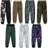 Pantaloni da uomo Pantaloni firmati Shark Camo Graphic Camouflage Pantaloni sportivi luminosi Colore Graffiti Jogging Cuciture Piedi con fascio Maschio Femmina Coppia