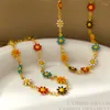 Chaînes en cuivre plaqué or véritable petite marguerite fraîche fleur bracelet collier coloré ins vent contraste design cadeau pour femme