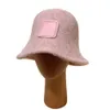 Дизайнерская женская шапка Колокольчик Теплая вязаная шапка зимой