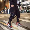 Mannen Broek mannen Lente Linten Amerikaanse Hip Hop Cargo Broek Trendy Koreaanse Overalls Mannen Merk Potlood Broek 231019