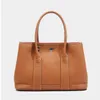 Sac de créateur de luxe sac à bandoulière asymétrique Simple et à la mode pour femmes avec un sac à main en peau de vache de couche supérieure