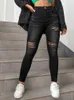 Kobiety czarne rozerwane chude dżinsowe spodnie