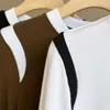 Diseñador de moda original camiseta de manga larga para mujer 2023 primavera otoño/invierno color sólido cuello redondo camisa entallada de manga larga.